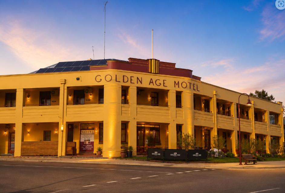 a white building with the words golden age month on it at Golden Age Hotel in Omeo
