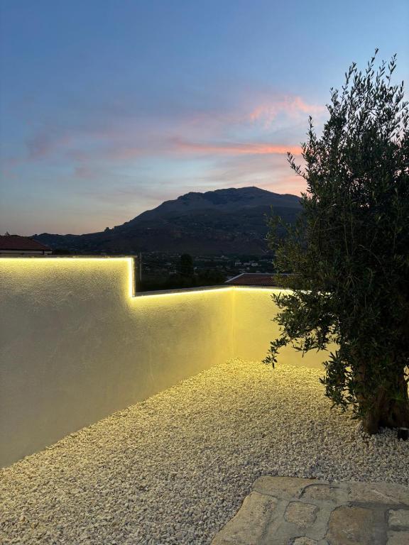 a pool of water with a view of a mountain at LE SORELLE Sea front -villa whit private pool in Scopello