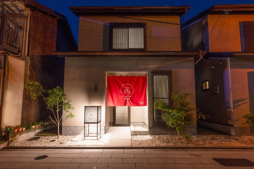 a red curtain on the side of a building at Irodori Hotel AKANE in Fukuoka