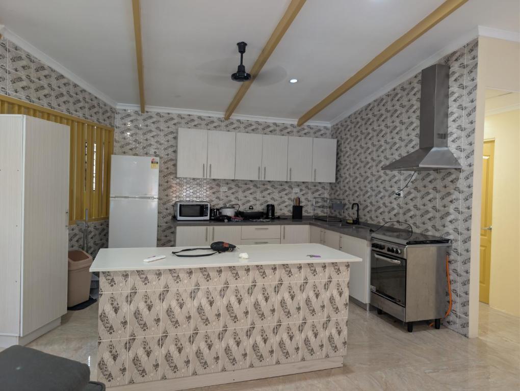 a kitchen with an island in the middle of it at Panatina Hillside 2 bedroom apartment in Honiara