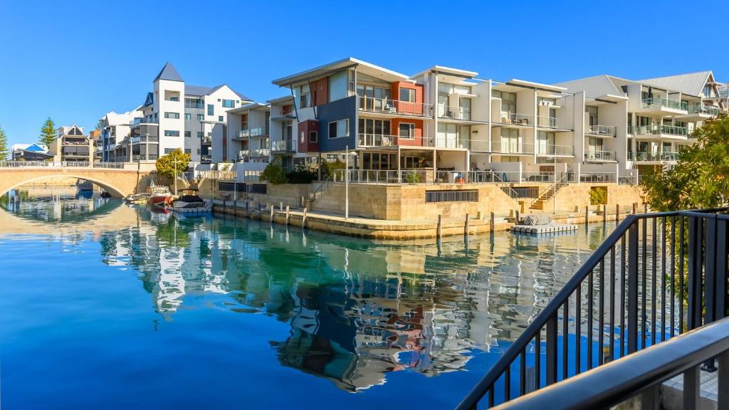 a group of apartment buildings next to a body of water at Del Mar 1 in Mandurah