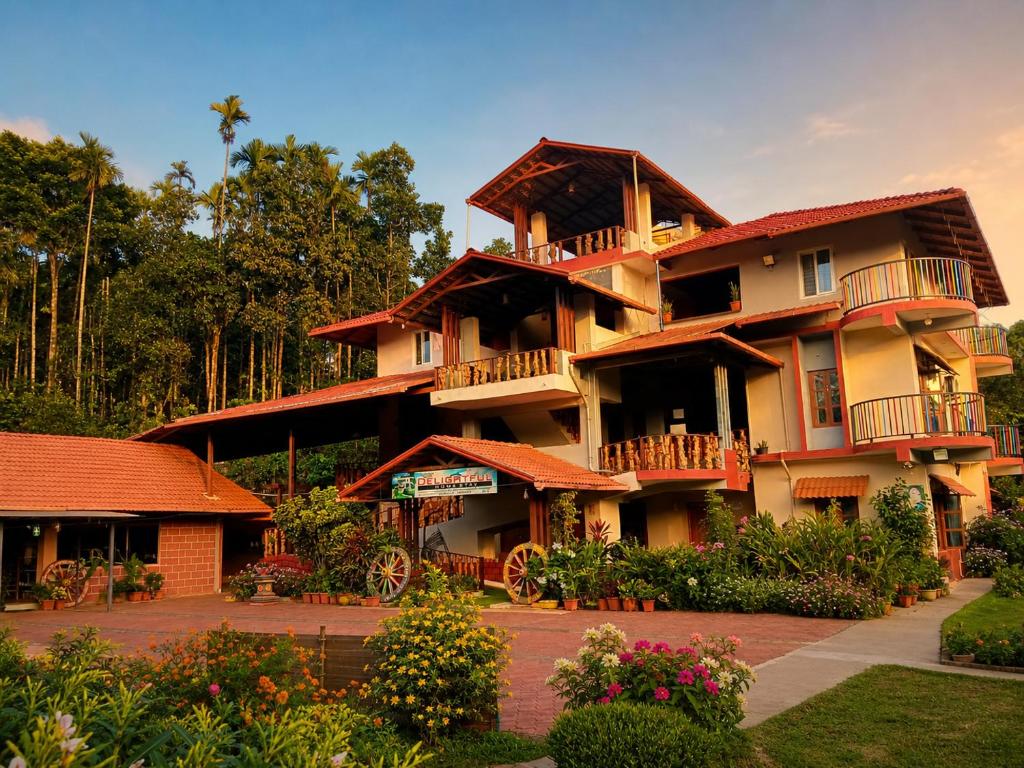 a large apartment building with balconies and flowers at DELIGHTFUL HOMESTAY in Sollebail