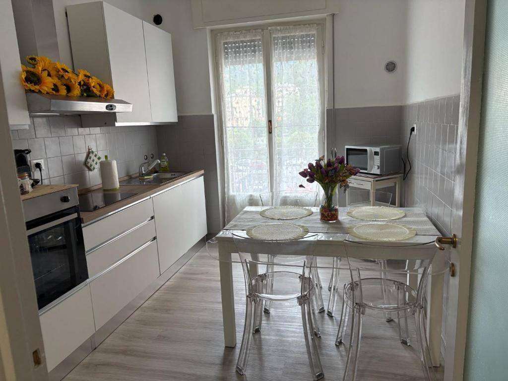 a kitchen with a table with three plates on it at I Tulipani in Genoa