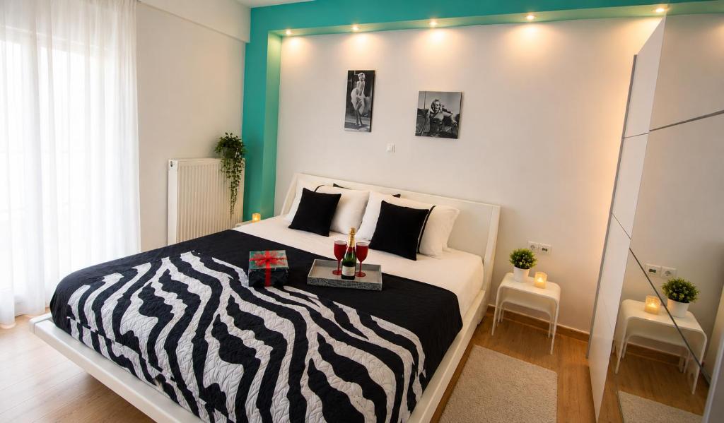 a bedroom with a zebra print bed in a room at KilkisLuxuryApartment in Kilkis