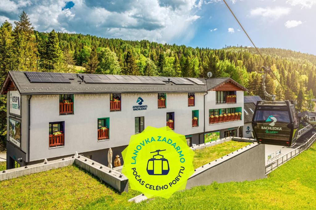 a gondola ride to a hotel in the mountains at Apartmány Bachledka in Ždiar