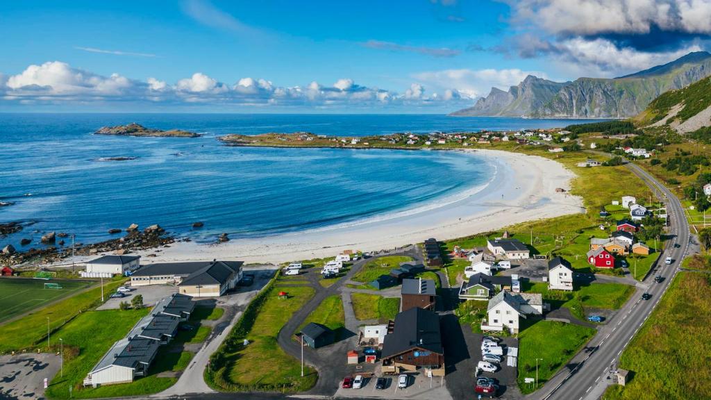an aerial view of a beach with houses and the ocean at ROOMS by Ramberg Beach in Ramberg