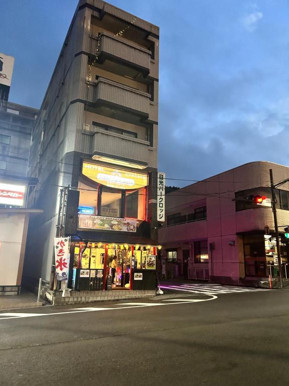 a building on the corner of a street at Nikko Park Lodge Tobu Station in Nikko