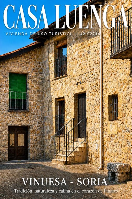 a magazine cover of a brick building with a staircase at Casa Luenga in Vinuesa