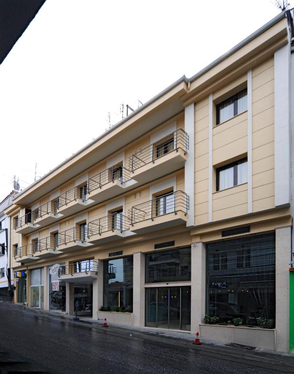a building with balconies on the side of a street at Europa Hotel in Kastoria