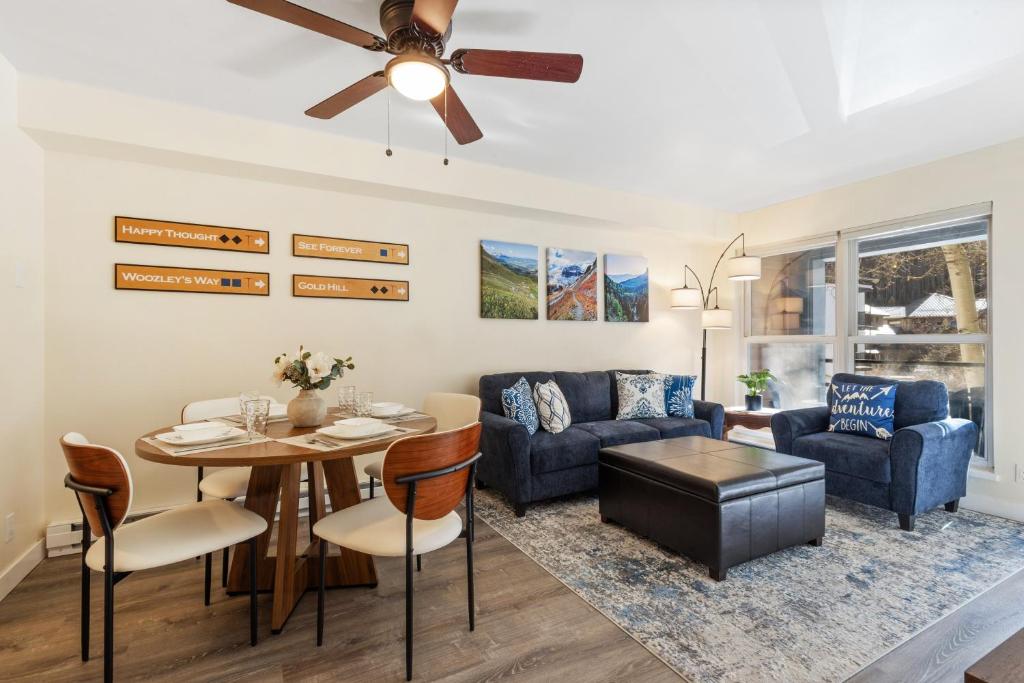 a living room with a couch and a table at Fall Line 107 in Telluride