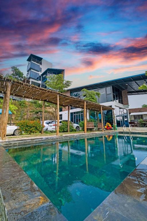 a swimming pool in front of a building at Nang Villa HA in Yên Bài