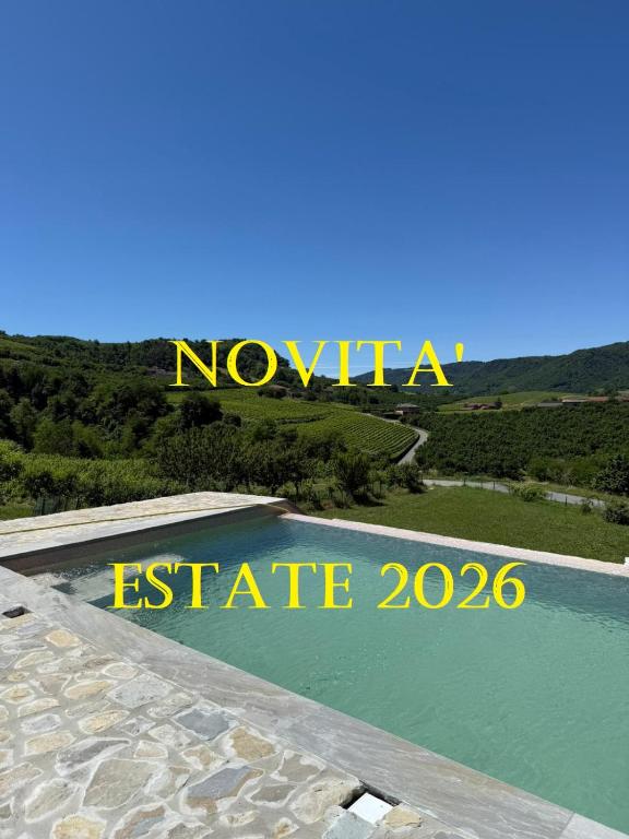 a sign that reads novia elite next to a lake at Corte di Langa in Rocchetta Belbo