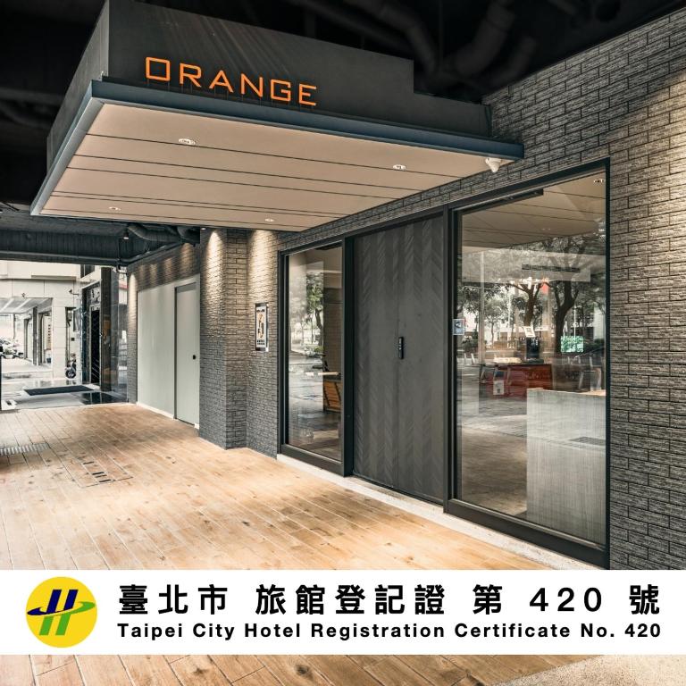 a entrance to a hotel with glass doors at Orange Hotel - Ximen, Taipei in Taipei