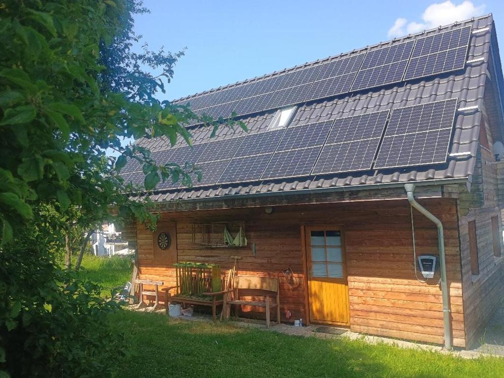 a house with solar panels on the roof at Holzhaus Rheingoldstraße 49a in Urbar