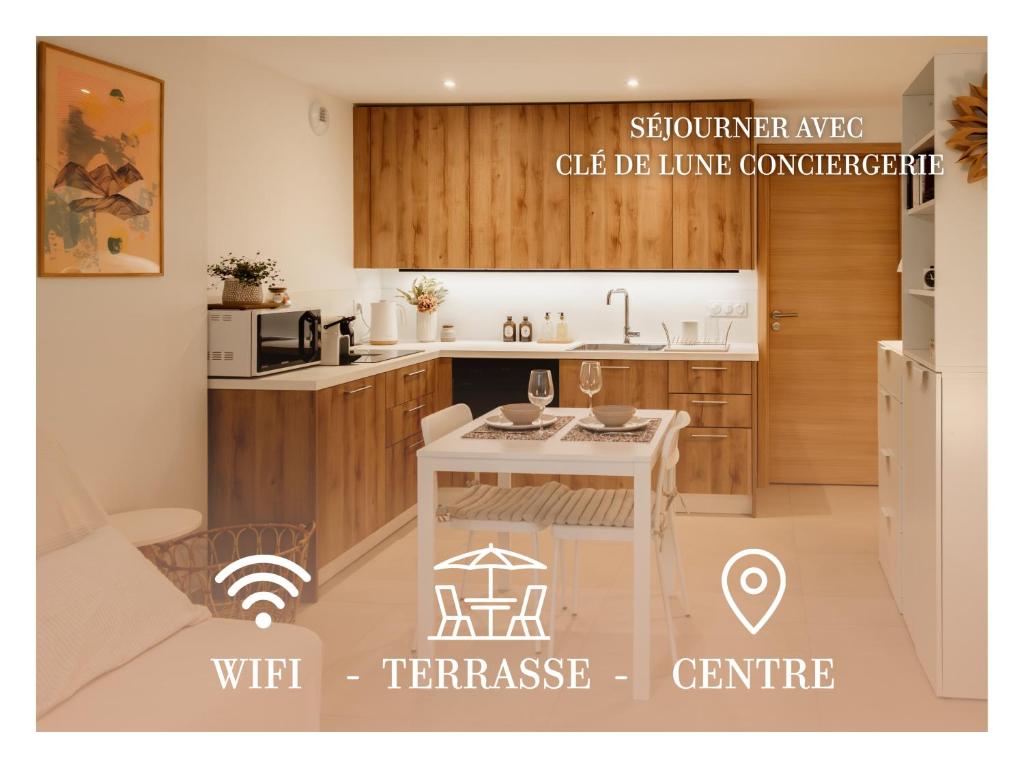 a rendering of a kitchen with a table with an umbrella at La Parenthèse - Appartement central avec terrasse in Pontarlier