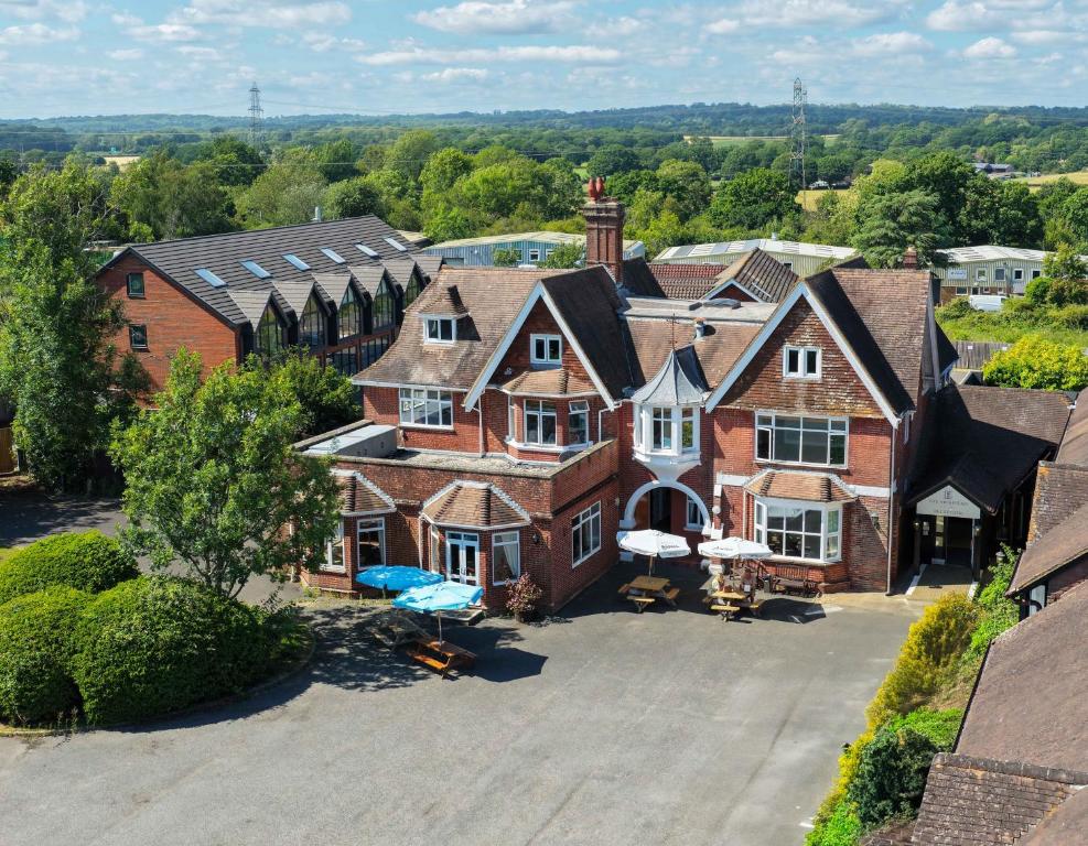 an aerial view of a large brick house at The Hickstead Hotel By Uno-FREE PARKING in Bolney