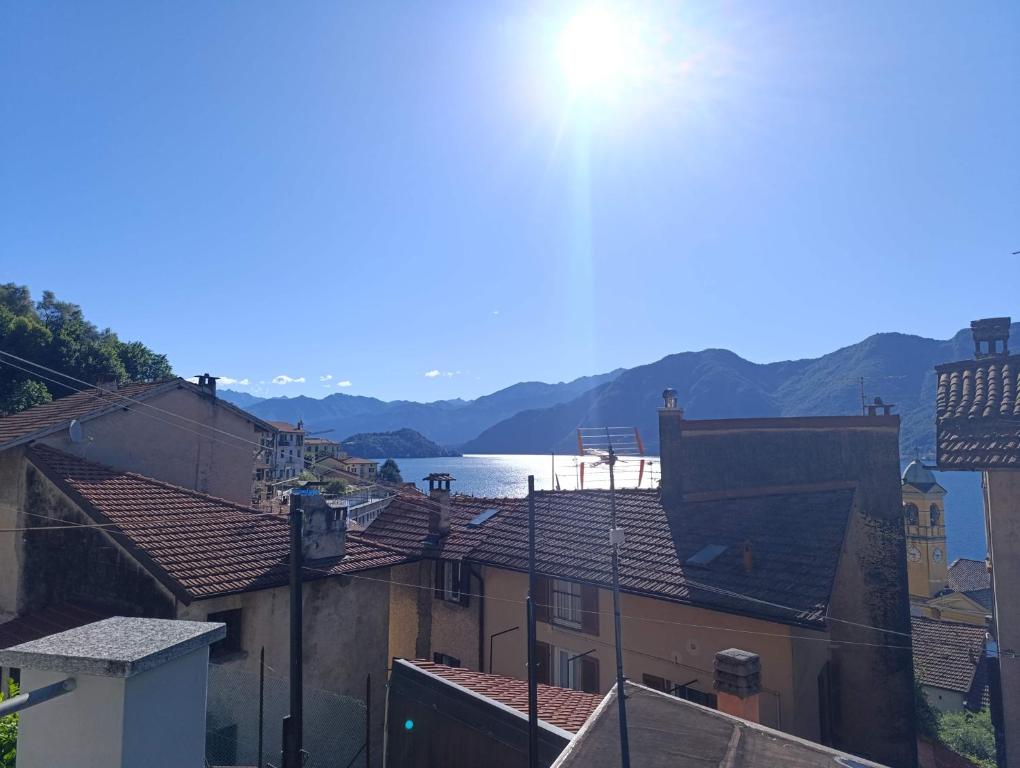 a view of a city with buildings and a body of water at The Lake Chime in Colonno