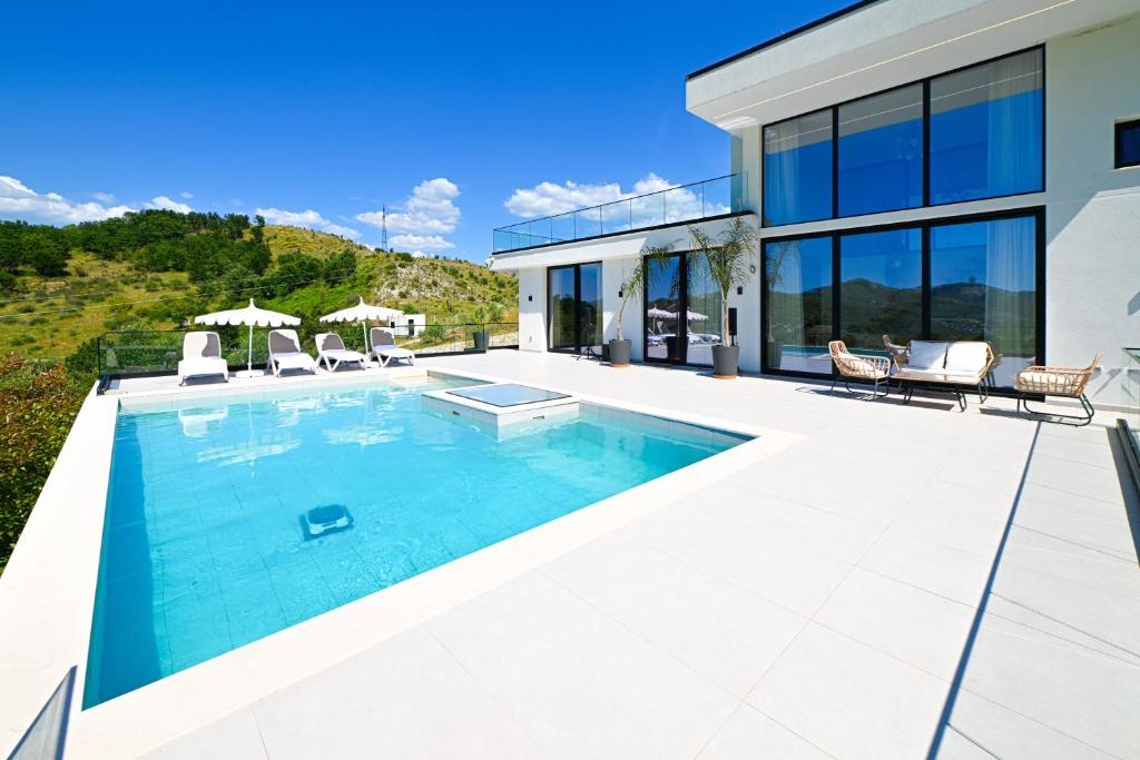 an image of a swimming pool in a house at Villa 30 Luxury Place Vlore in Fshati i Ri