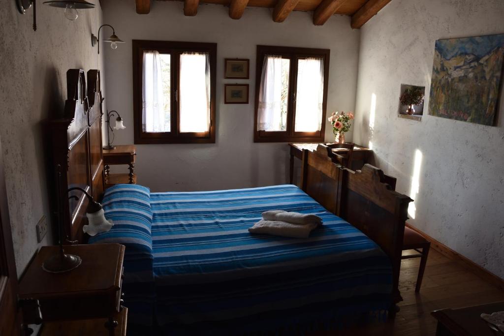 A bed or beds in a room at Ca Borgh