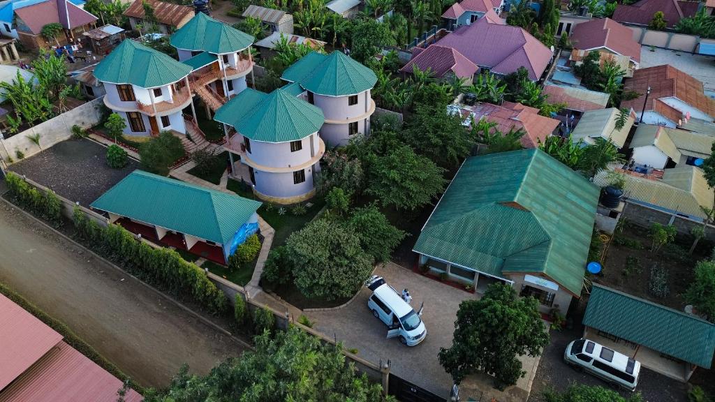 an overhead view of a house with green roofs at Wademac Arusha Inn Hotel in Arusha