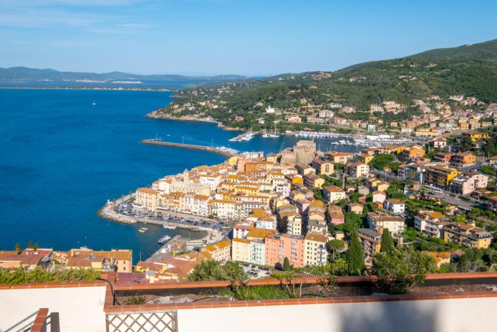 an aerial view of a town on the water at Residence Sole Dell'Argentario in Porto Santo Stefano