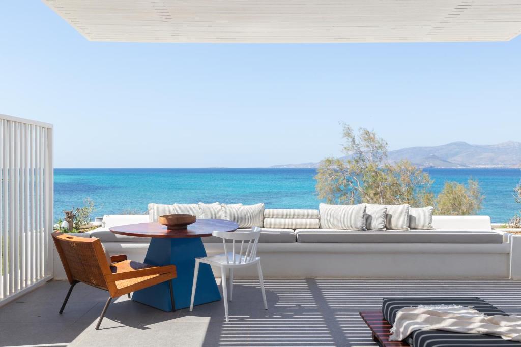 a living room with a couch and a table at Santana Beach in Agia Anna Naxos
