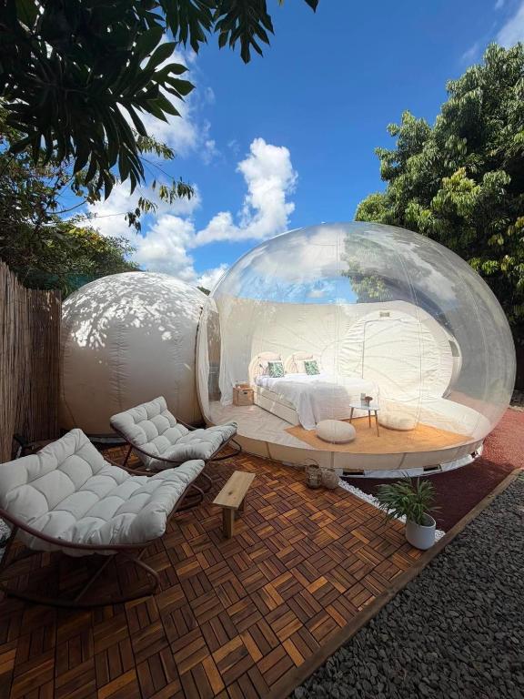 a large glass dome with a bedroom inside of it at Entre 2 bulles in Entre-Deux