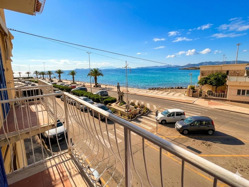 a balcony of a building with a view of the ocean at Corso79 in Porto Santo Stefano
