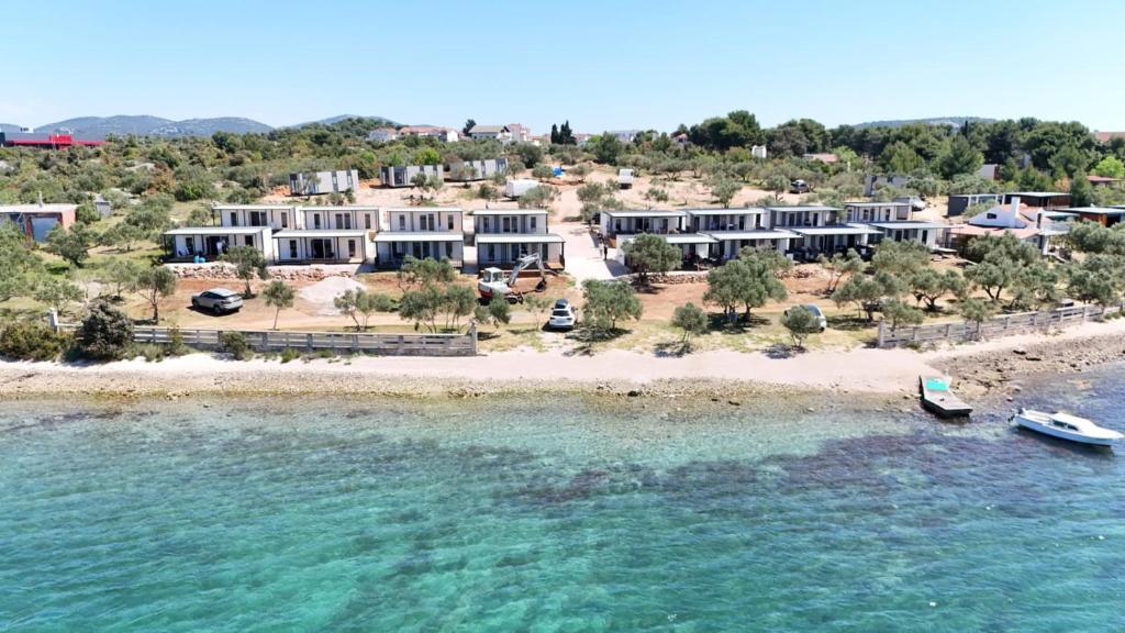 an aerial view of a resort on a beach at Mobile Homes Gasperino in Pirovac