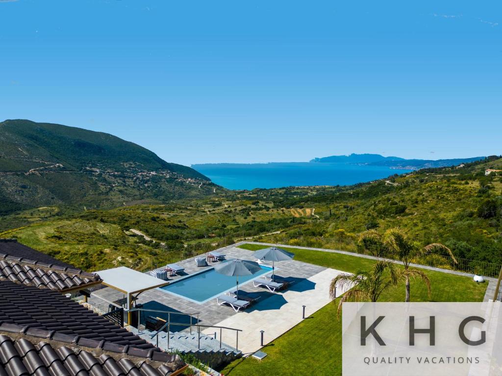 an aerial view of a villa with a swimming pool at Villa Guapa in Kardhakáta