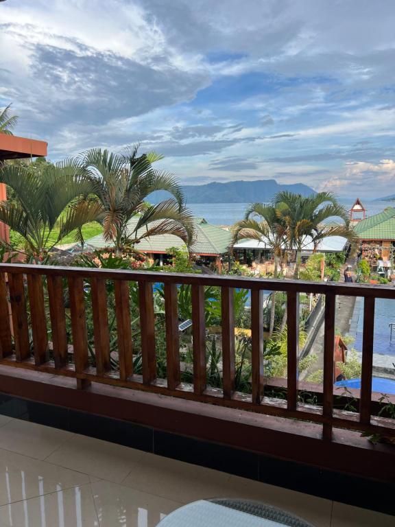 a view from the balcony of a resort at Toba Village Inn in Tuktuk Siadong