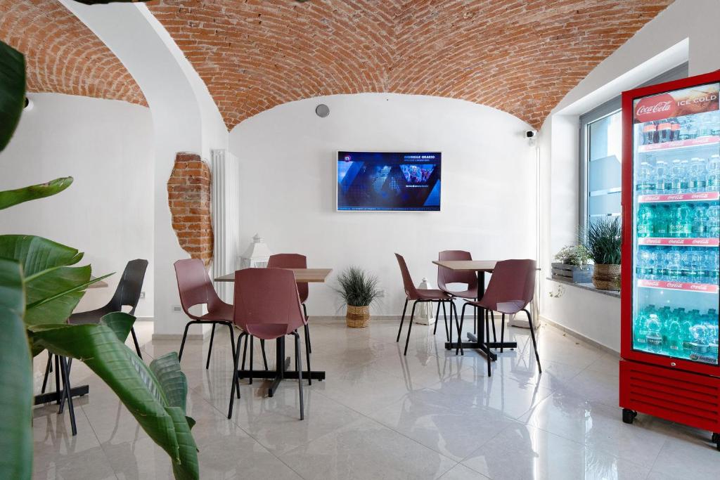 a dining room with a table and chairs at Affitta Camere Novara in Novara