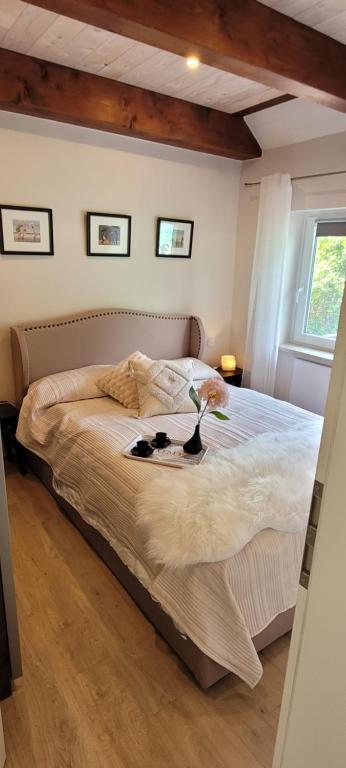 a bedroom with a bed with two shoes on it at Ferienhaus Landidyll in Fehmarn