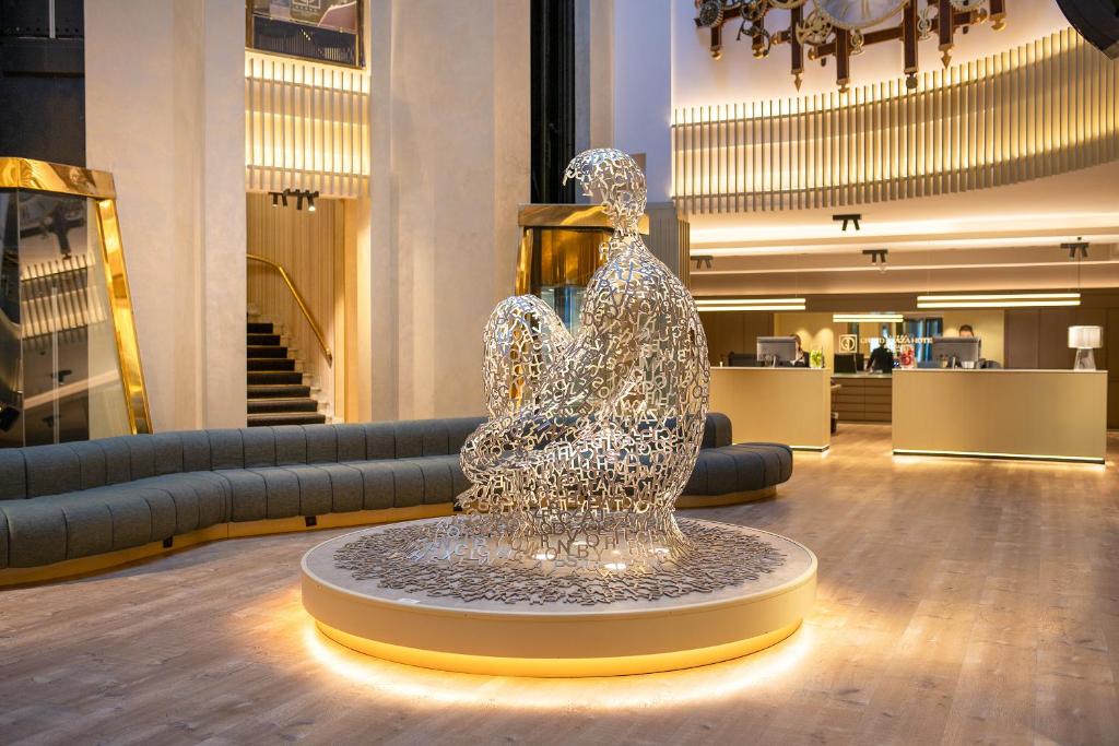 a sculpture of a bird in a lobby at Grand Plaza Hotel & Wellness in Andorra la Vella