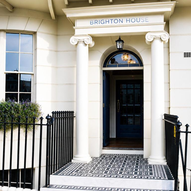 a front door of a building with aption house at Brighton House in Brighton & Hove