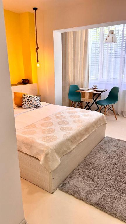 Un pat sau paturi într-o cameră la Angel Studio Central