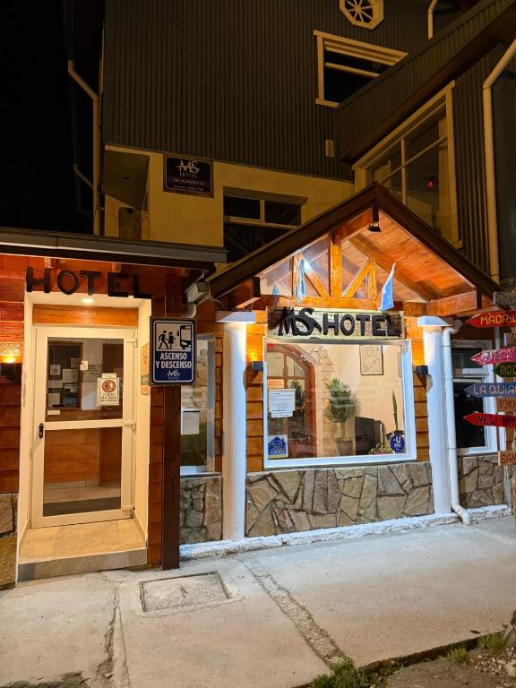 a hotshot restaurant with its door open at night at MS Hotel Campos 26 in Ushuaia