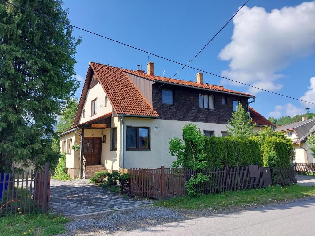 a white house with an orange roof at Forester Apartment Zuberec in Zuberec