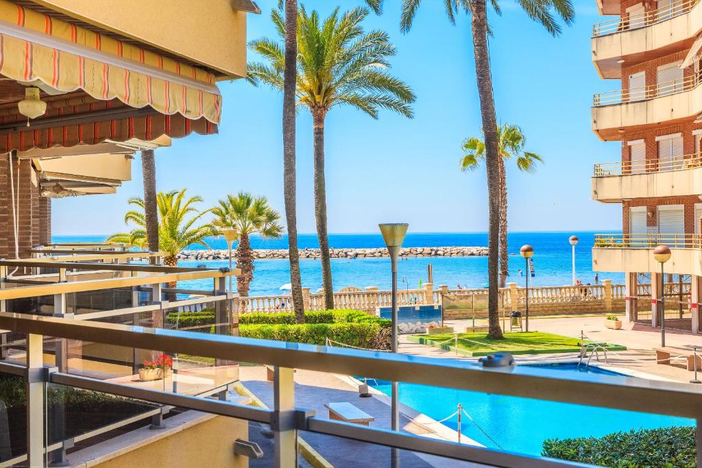 a view of the beach from the balcony of a resort at Rentalmar Sol de España - Mas d'en Gran in Cambrils