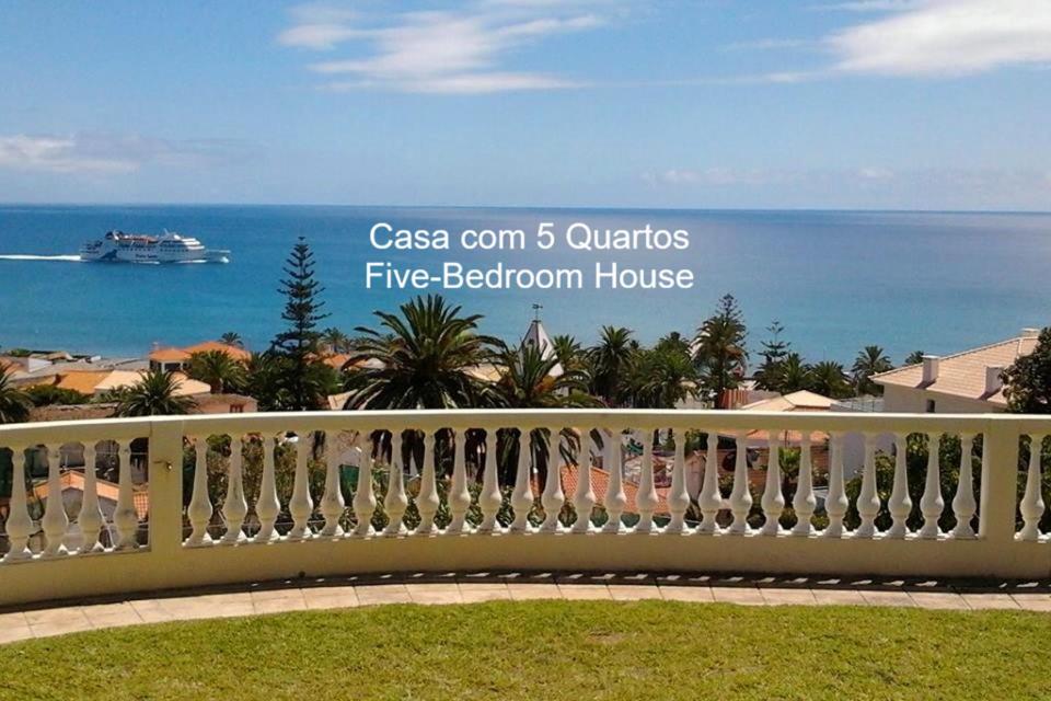 a white fence with a view of the ocean at First Balcony - Porto Santo in Porto Santo