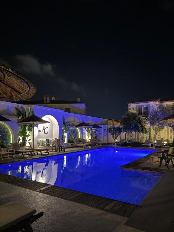 a swimming pool at night in a resort at Bay C in Alaçatı