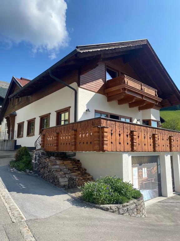 a house with a deck on the side of it at Alpin Haus Berwang in Berwang
