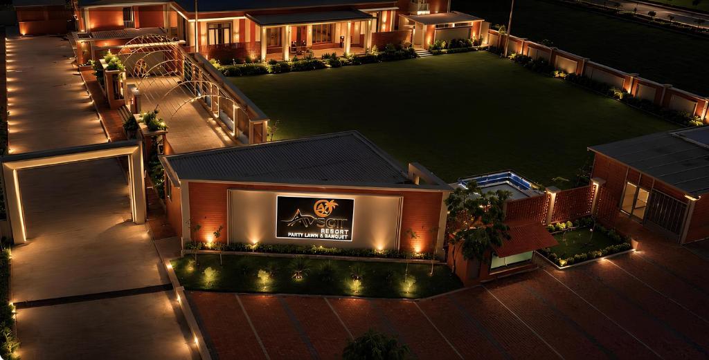 an overhead view of a building with a large lawn at Avsar Resort in Verāval