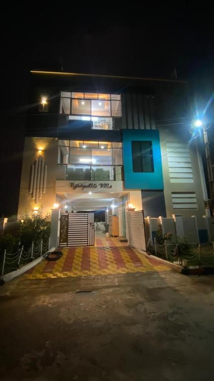 a building with a lit up front at night at Vihari Luxury Resort in Alamanda