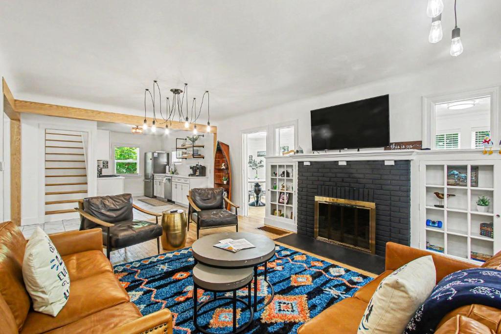 a living room with a couch and a fireplace at Union Retreat in Douglas
