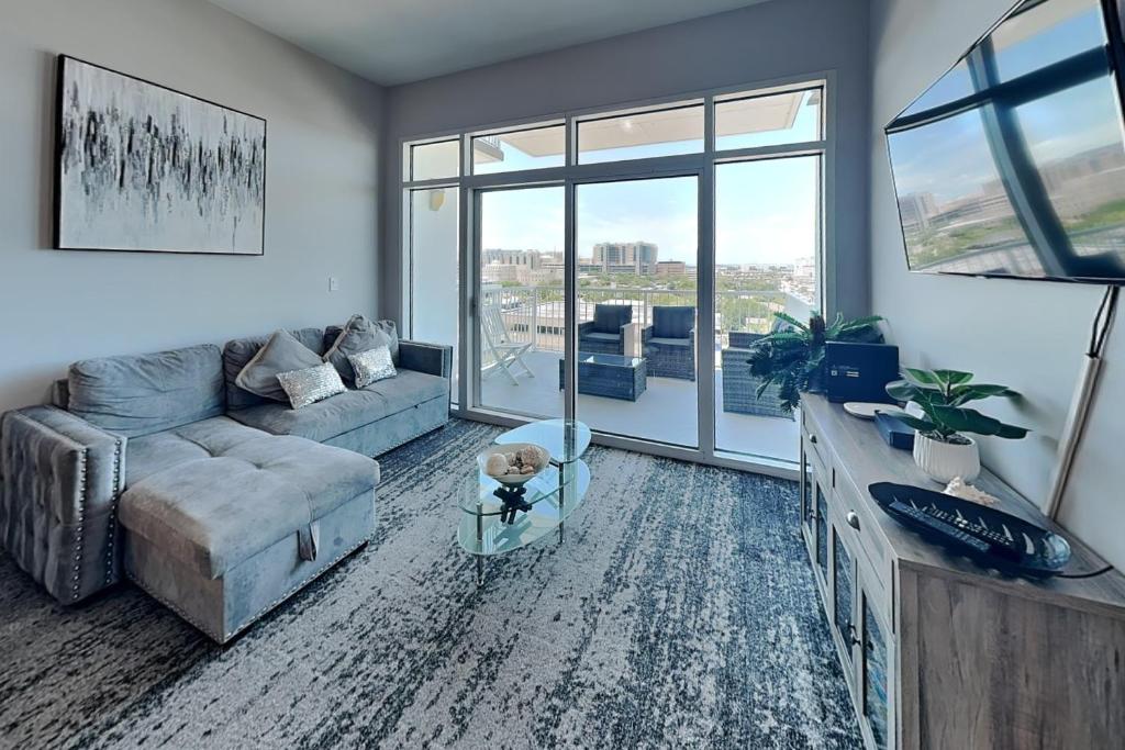 a living room with a couch and a table at Emerald 705 in Galveston