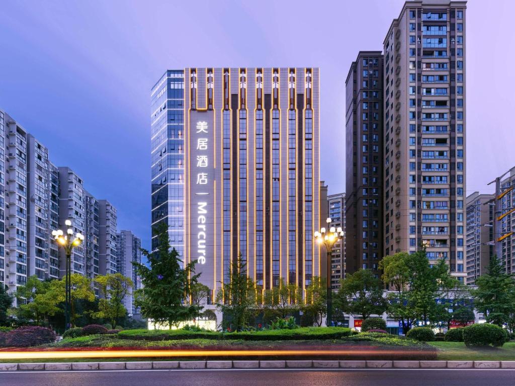 a large building in a city with tall buildings at Mercure Chengdu Xindu in Chengdu