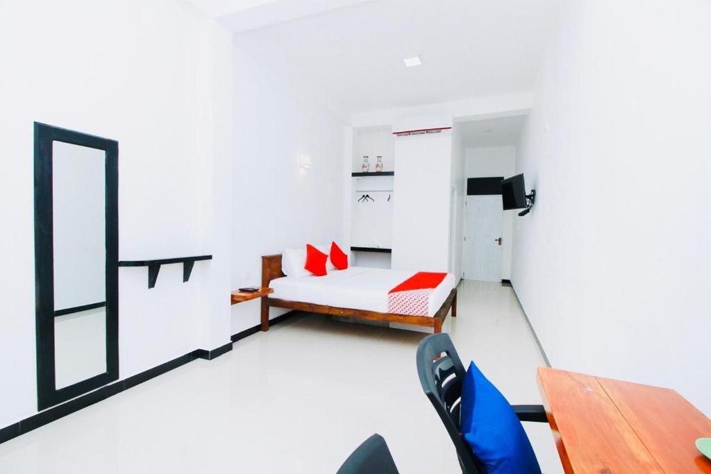 a living room with a couch and a table at Lodge 52 in Negombo