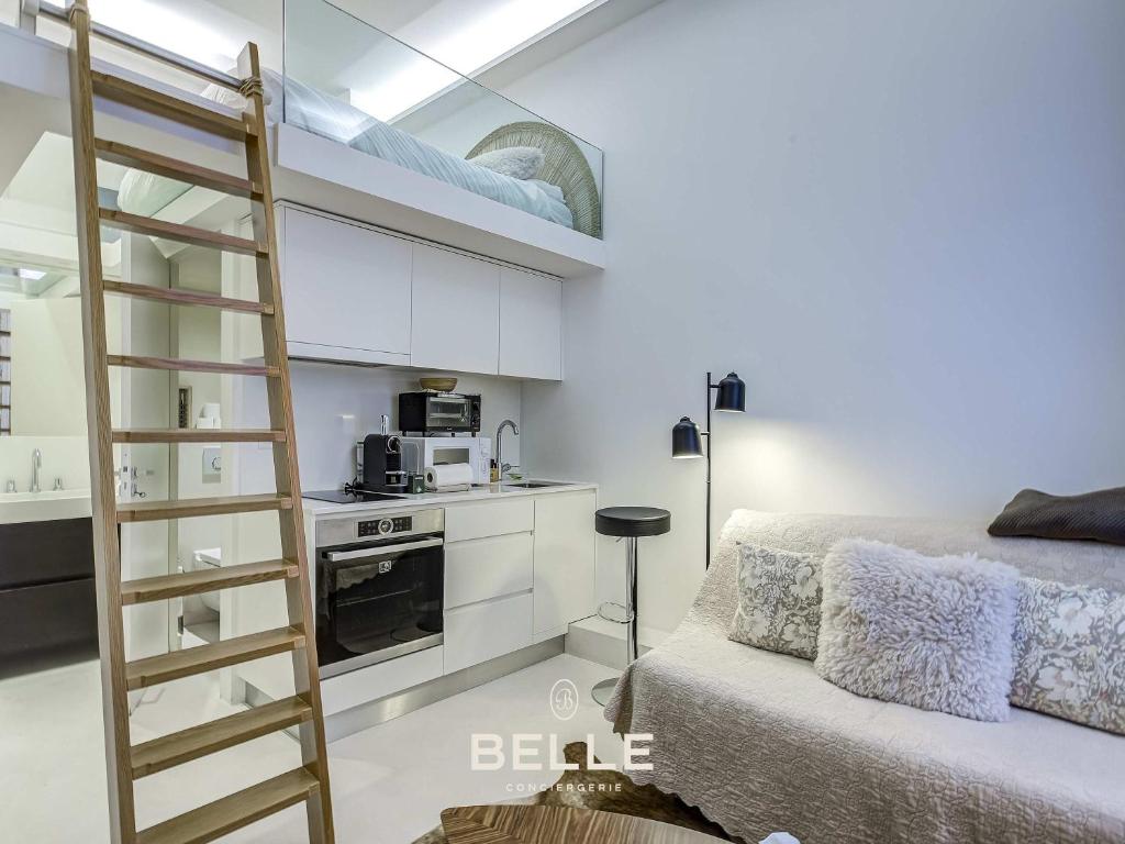 a bedroom with a bunk bed and a kitchen in it at Rocher - 3min Port Hercule - Casino in Monte Carlo
