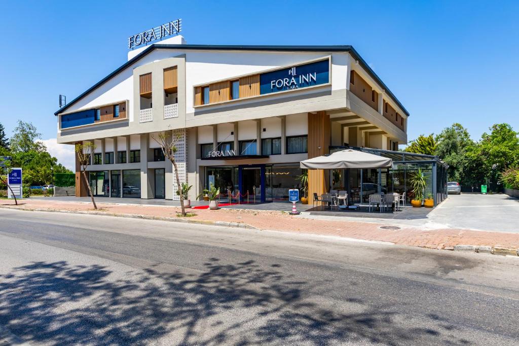 a building on the side of a street at Fora Inn Lara in Antalya
